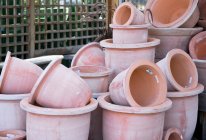 Stacked terracotta pots in garden center. — Stock Photo