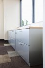 Filing cabinet and window in office. — Stock Photo