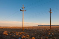 Power lines in desert landscape. — Stock Photo