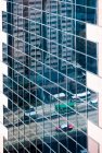 Reflection of city traffic in high rise building. — Stock Photo