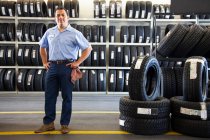 Portrait of Hispanic male owner in auto repair shop — Stock Photo