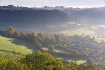 View over Uley village in the Cotswolds, mist and clouds. — Stock Photo