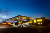 Gas station, petrol station on a road at dusk. — Stock Photo