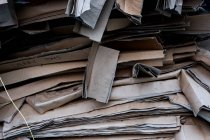 Close up of a stack of flattened old cardboard boxes. — Stock Photo