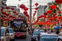 Busy street in downtown Yangon decorated with red chinese lanterns in preparation for Chinese New Year celebrations Myanmar — Stock Photo