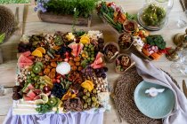 Rustic place setting for a feast and naming ceremony in a forest. — Stock Photo