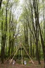 Wooden structure with wreath for a woodland naming ceremony. — Stock Photo