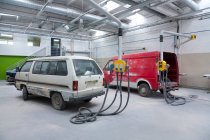 Two vans in a large repair workshop for repair and respraying — Stock Photo