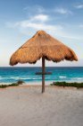 Palapa thatched shade on the  beach. — Stock Photo
