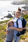 Teenage girl and younger brother hiking the De Kelders coastal trail, South Africa — Stock Photo