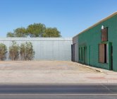 Abandoned warehouse and buildings with plants growing on the walls. — Stock Photo