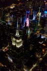 The city of New York City, Manhattan, aerial view at night. — Fotografia de Stock