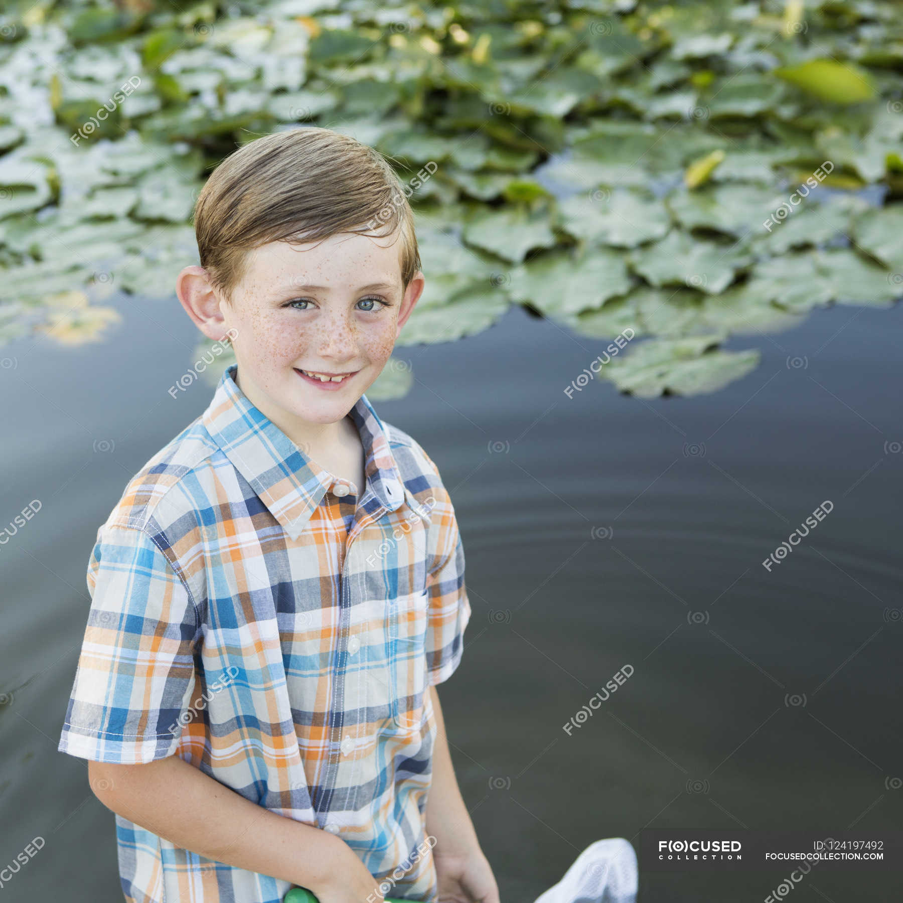 boy-standing-in-shallow-water-texas-people-stock-photo-124197492