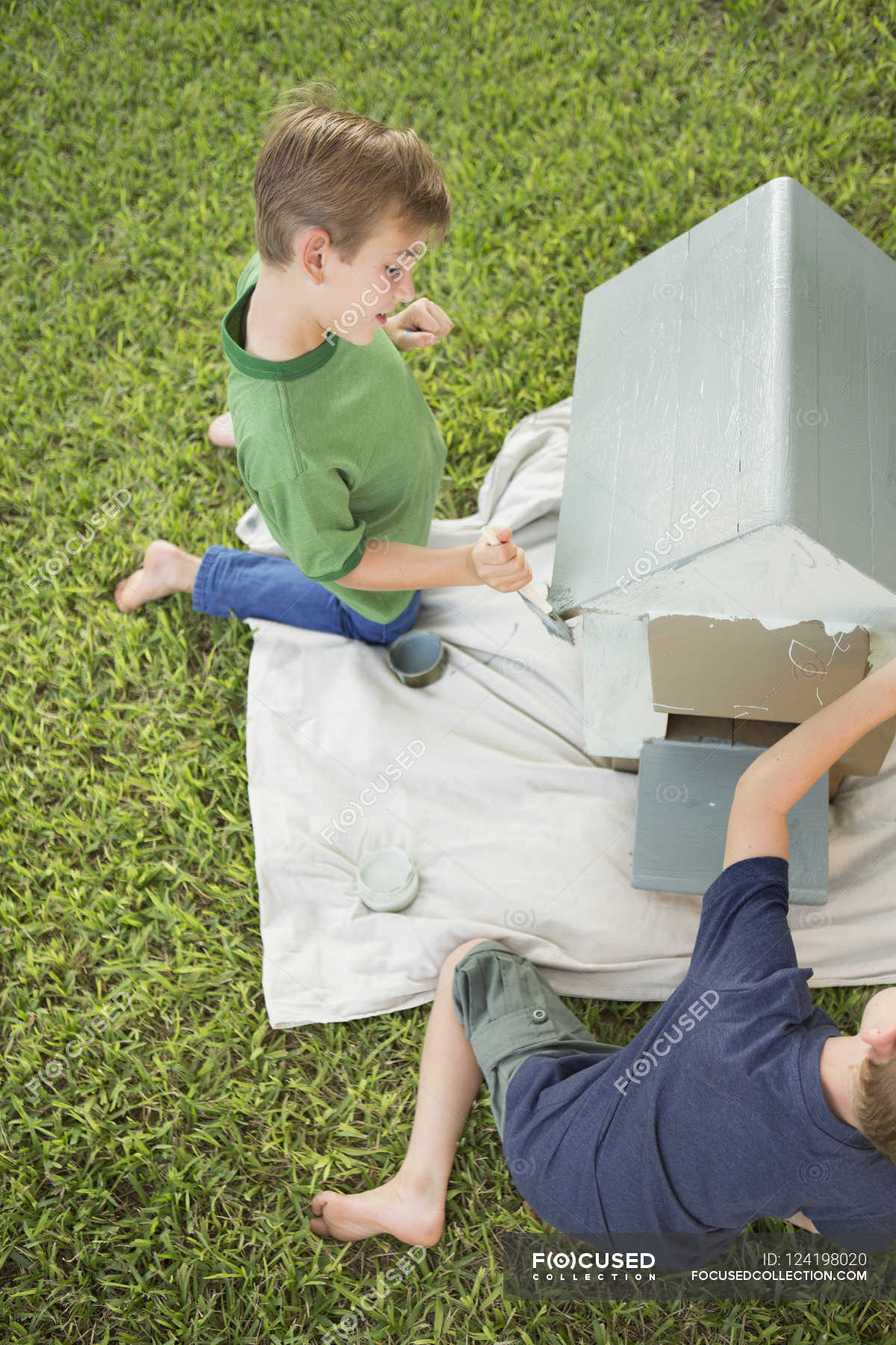 Brothers painting dog house — High Angle View, grounds Stock Photo
