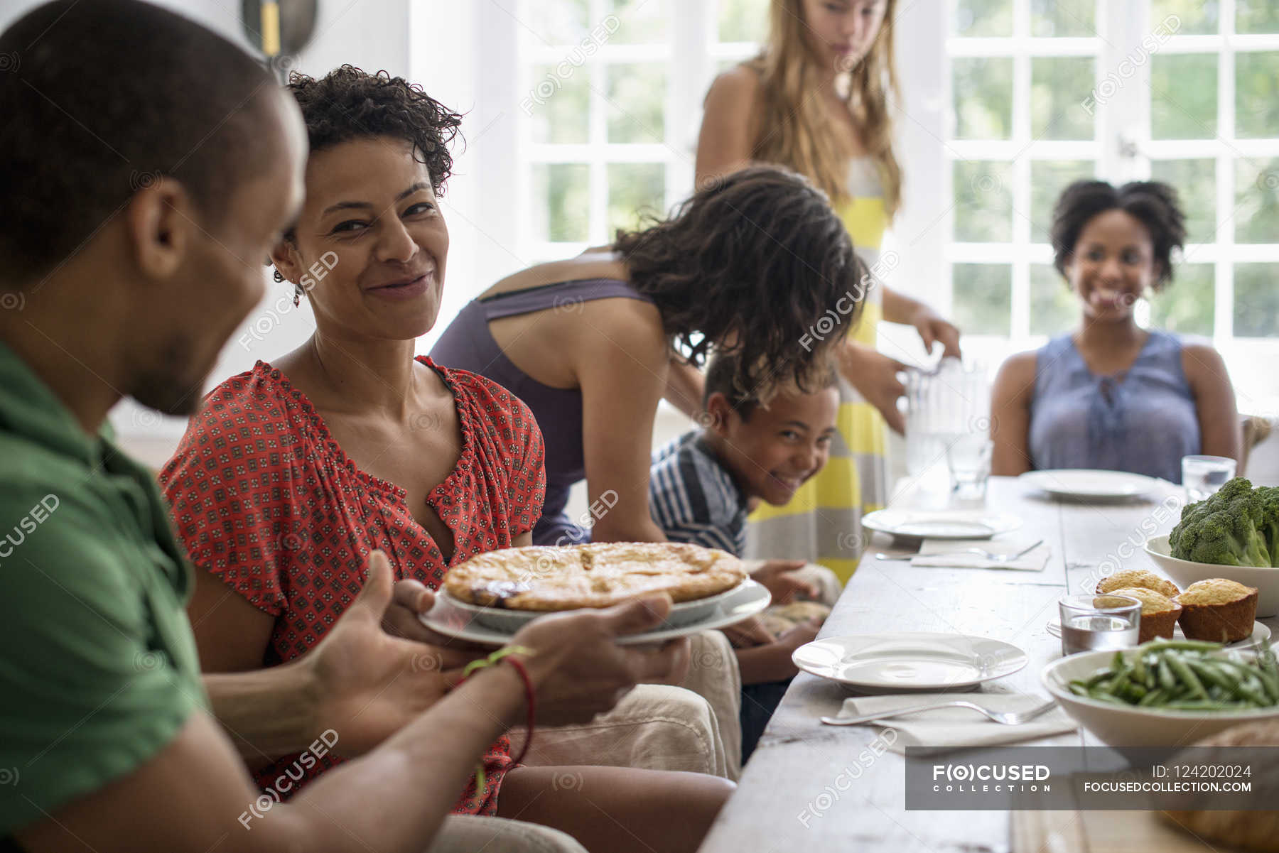 Family sharing a meal. — summer, plate Stock Photo 124202024