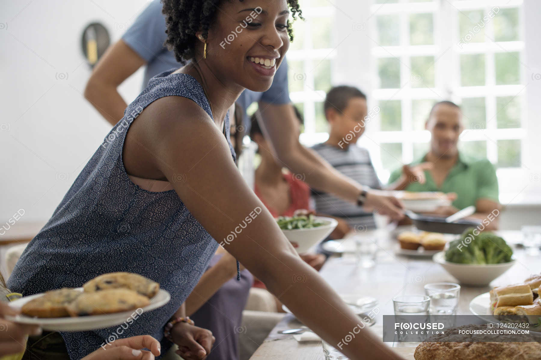 Family sharing a meal. — family meal kinfolk, 7 9 years - Stock Photo ...