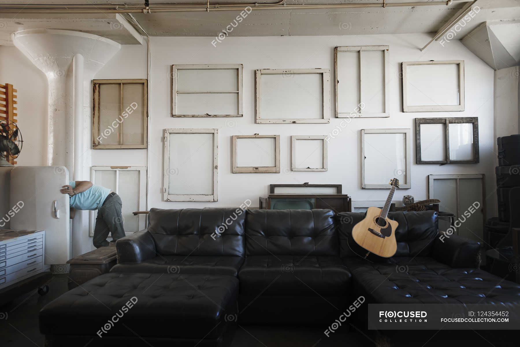 Wall hung with pictures in frames — daytime, musical equipment - Stock