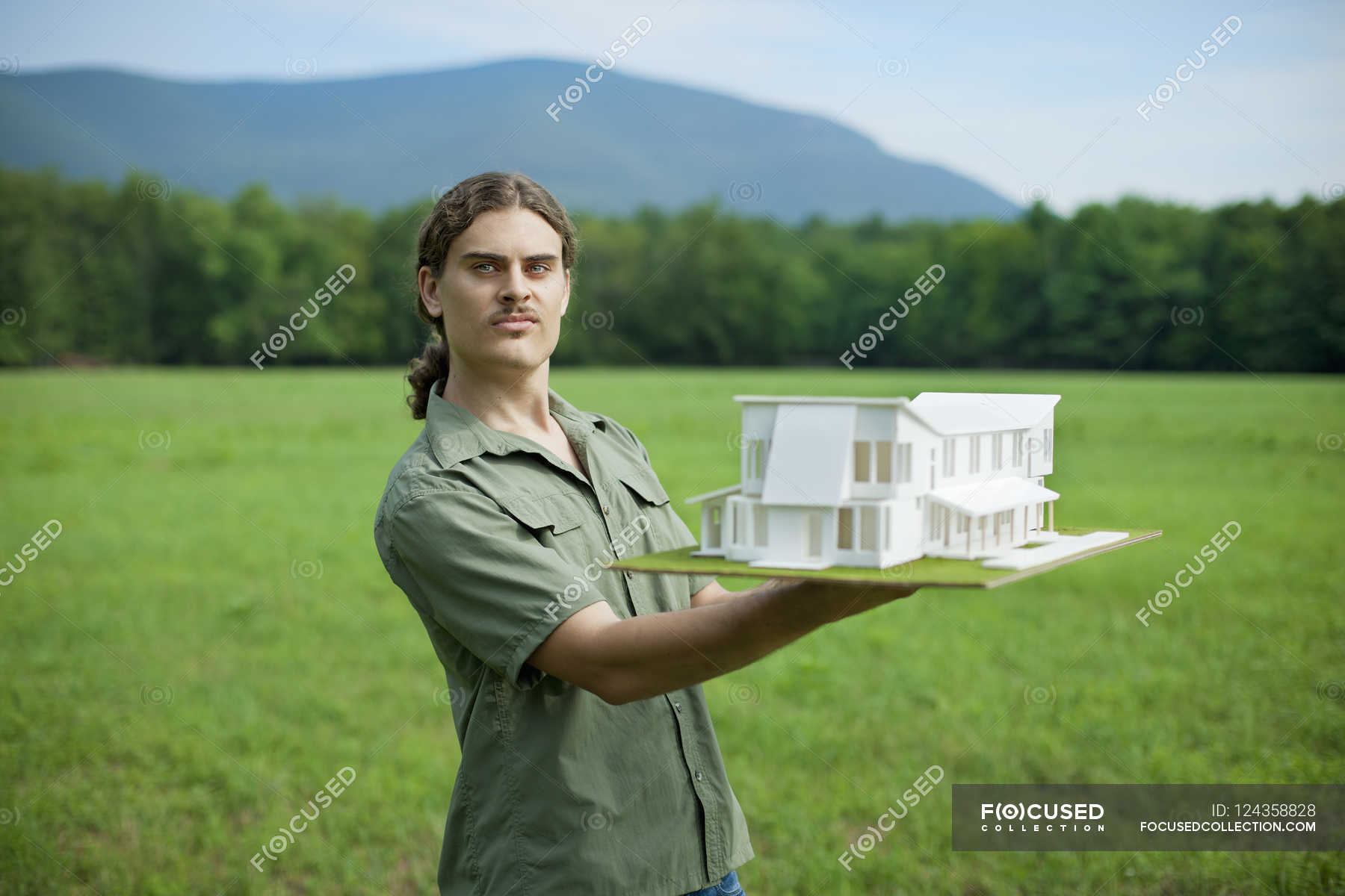 person-holding-scale-model-of-building-manual-worker-massachusetts