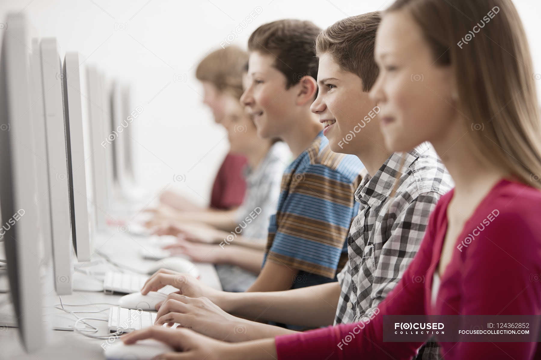Students in a computer class — peer group, digital skills - Stock Photo ...
