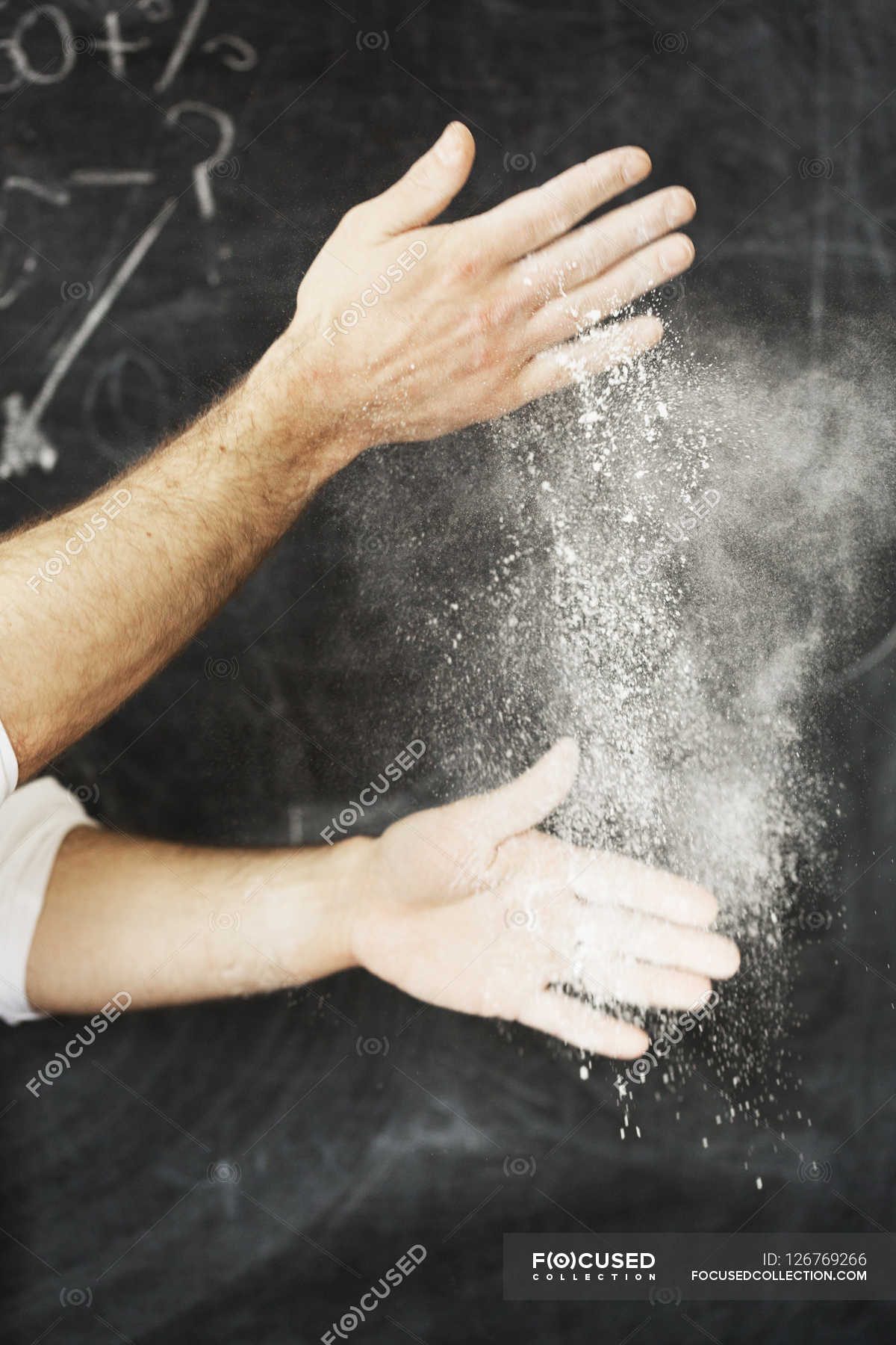 Baker dusting his hands with flour. — bakery, working Stock Photo