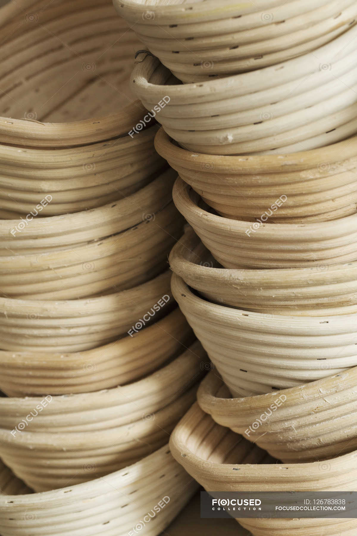 Stack of rattan proofing baskets. — photography, Colour Image Stock