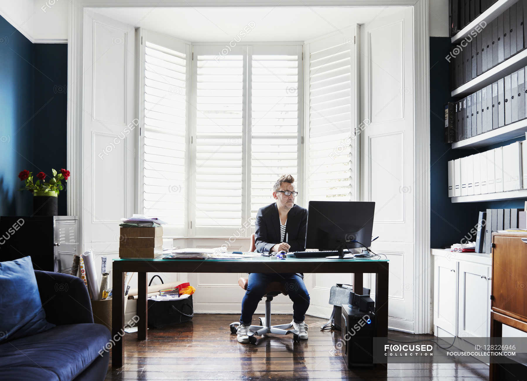 Businessman Sitting At Desk In Bay Window Working Life Designer