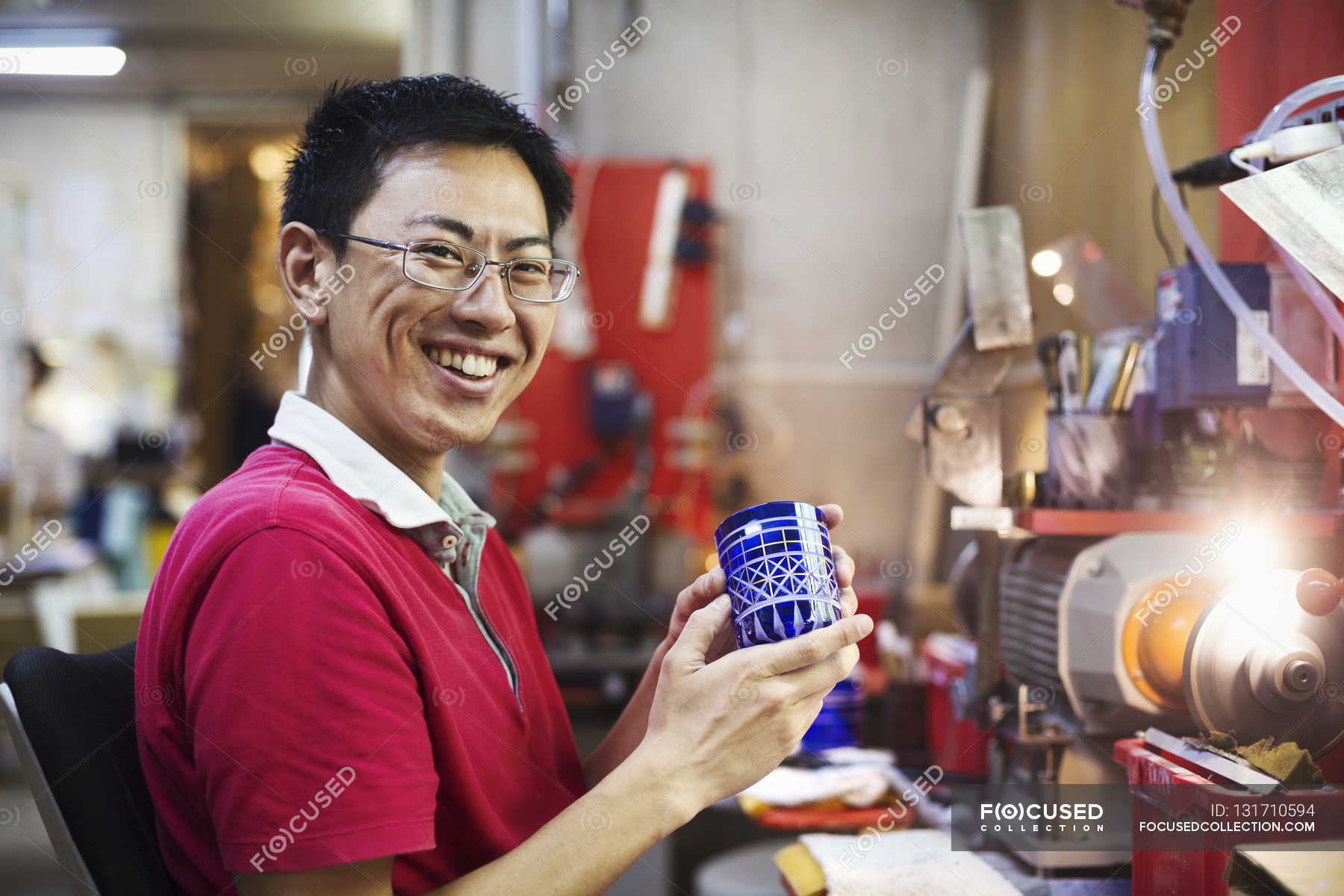 Craftsman in a glass maker's — horizontal, asian ethnicity