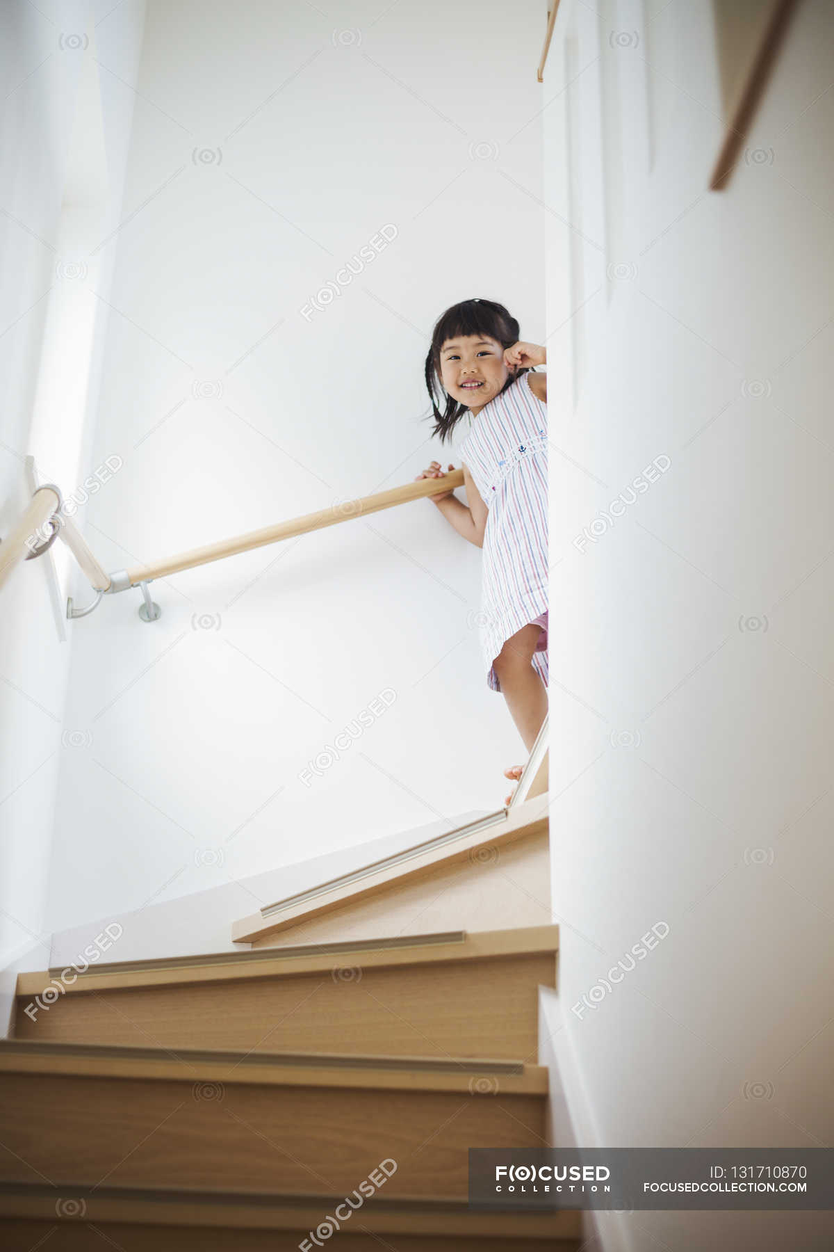 Girl walking down stairs. — Colour Image, Domestic Life - Stock Photo ...