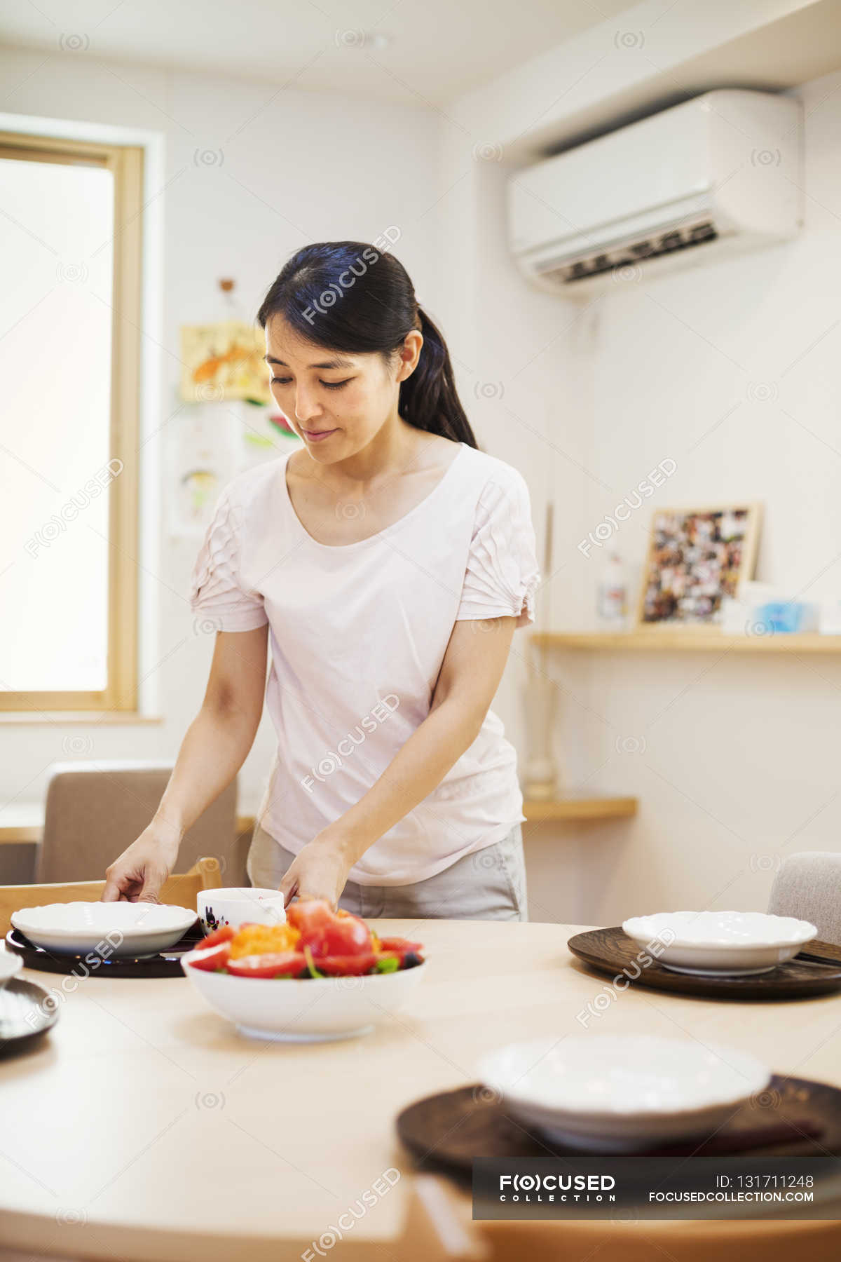 Woman preparing a meal — female, candid - Stock Photo |#131711248