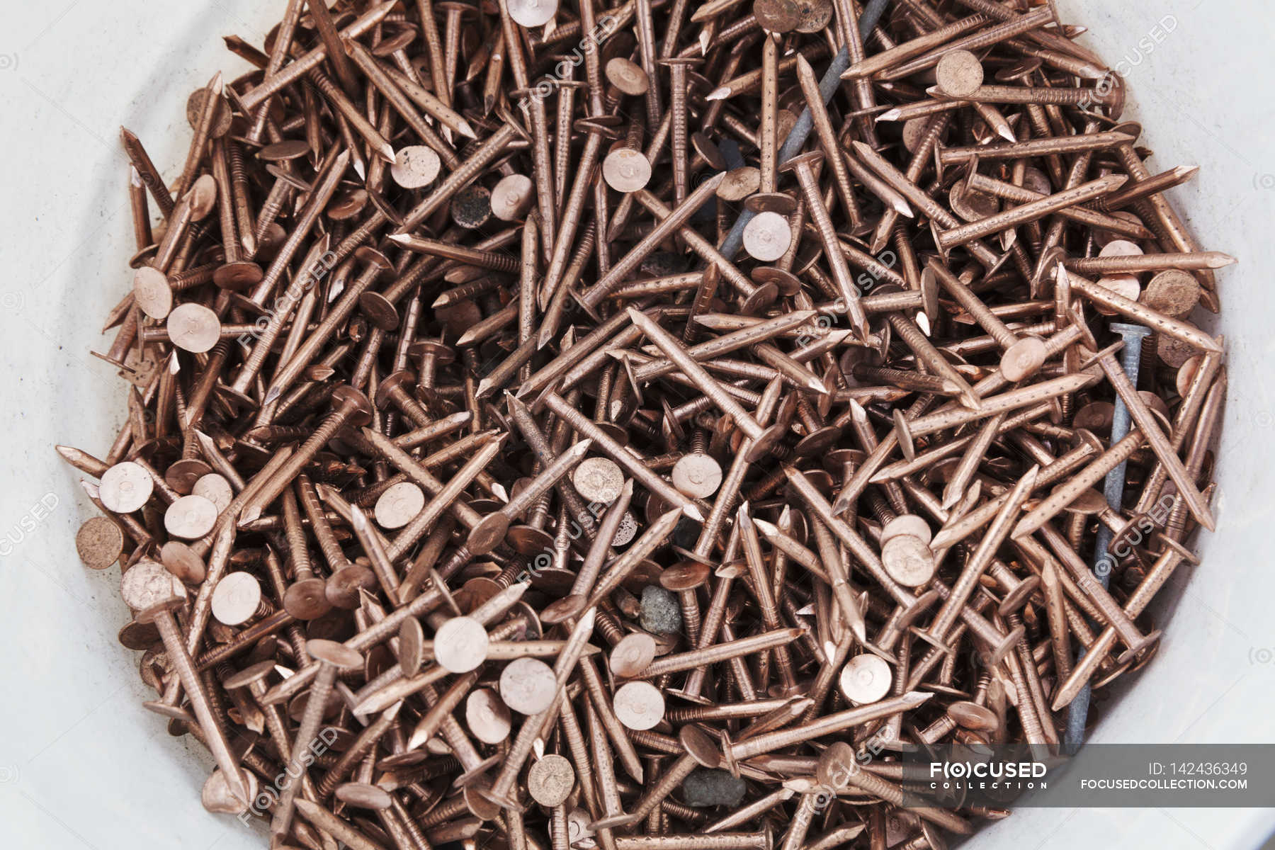 Bucket of copper nails — pail, horizontal - Stock Photo | #142436349