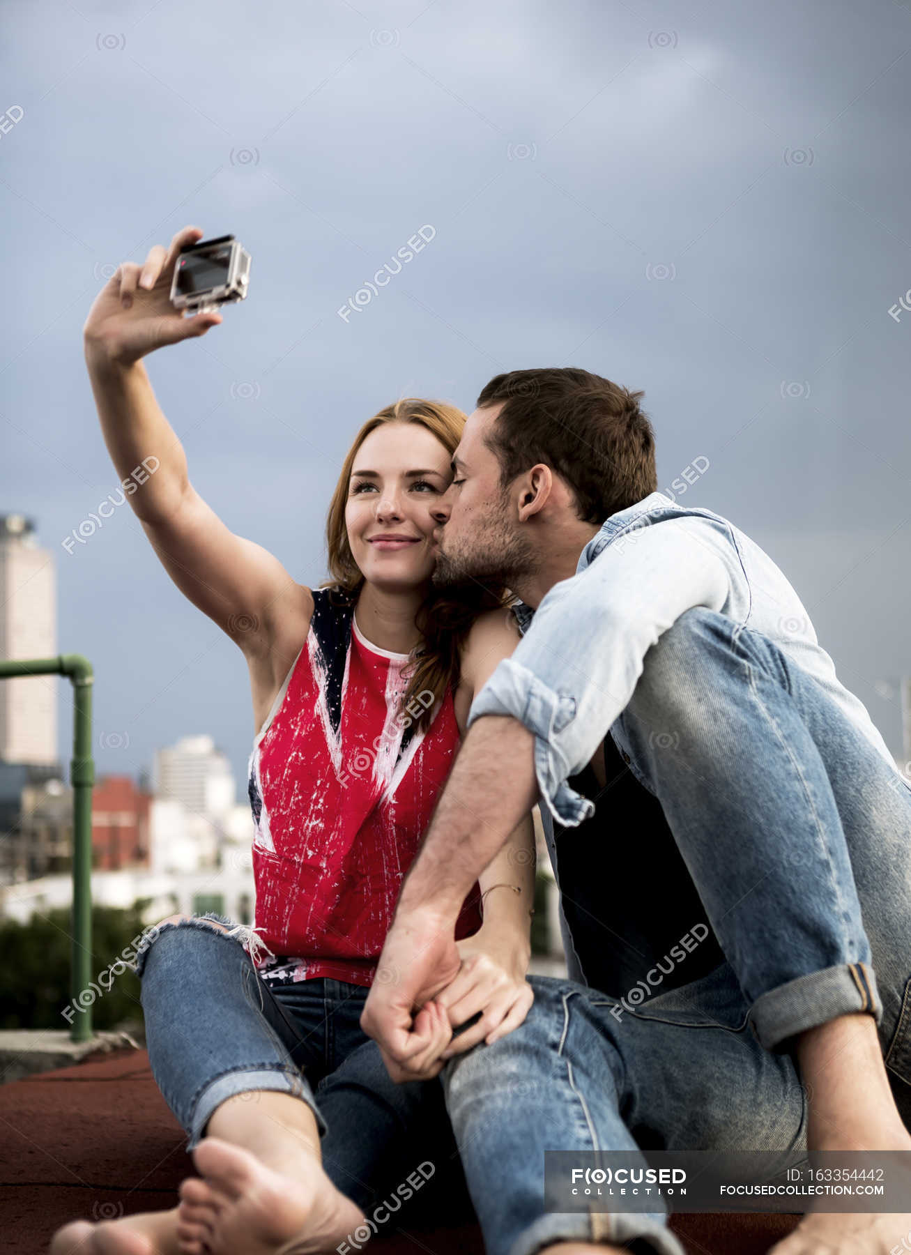 Kissing Mature Couple Posing for Selfie on Mobile Phone Sitting on Seat in  Park Stock Photo - Image of horizontal, posting: 227675618