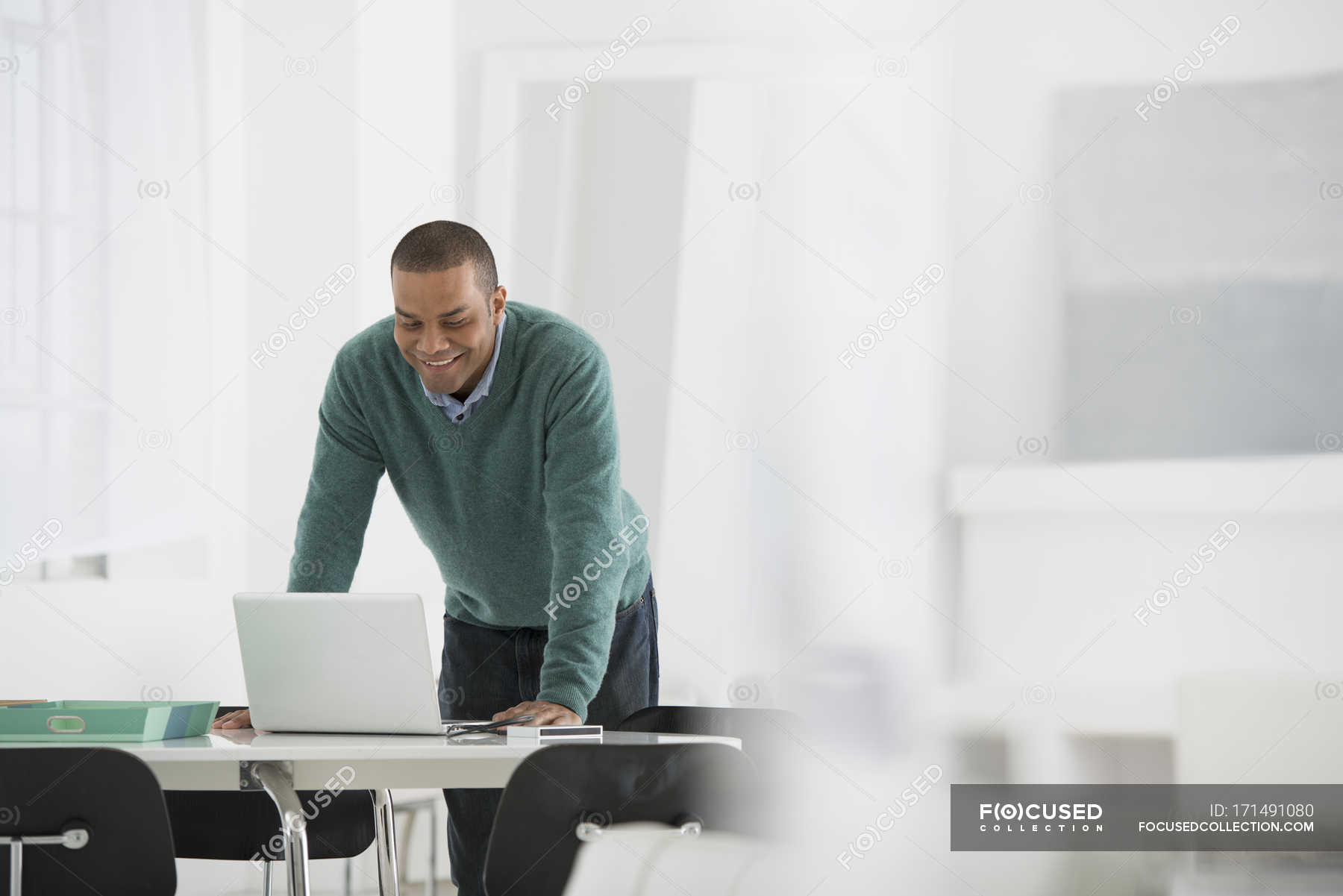 standing with laptop