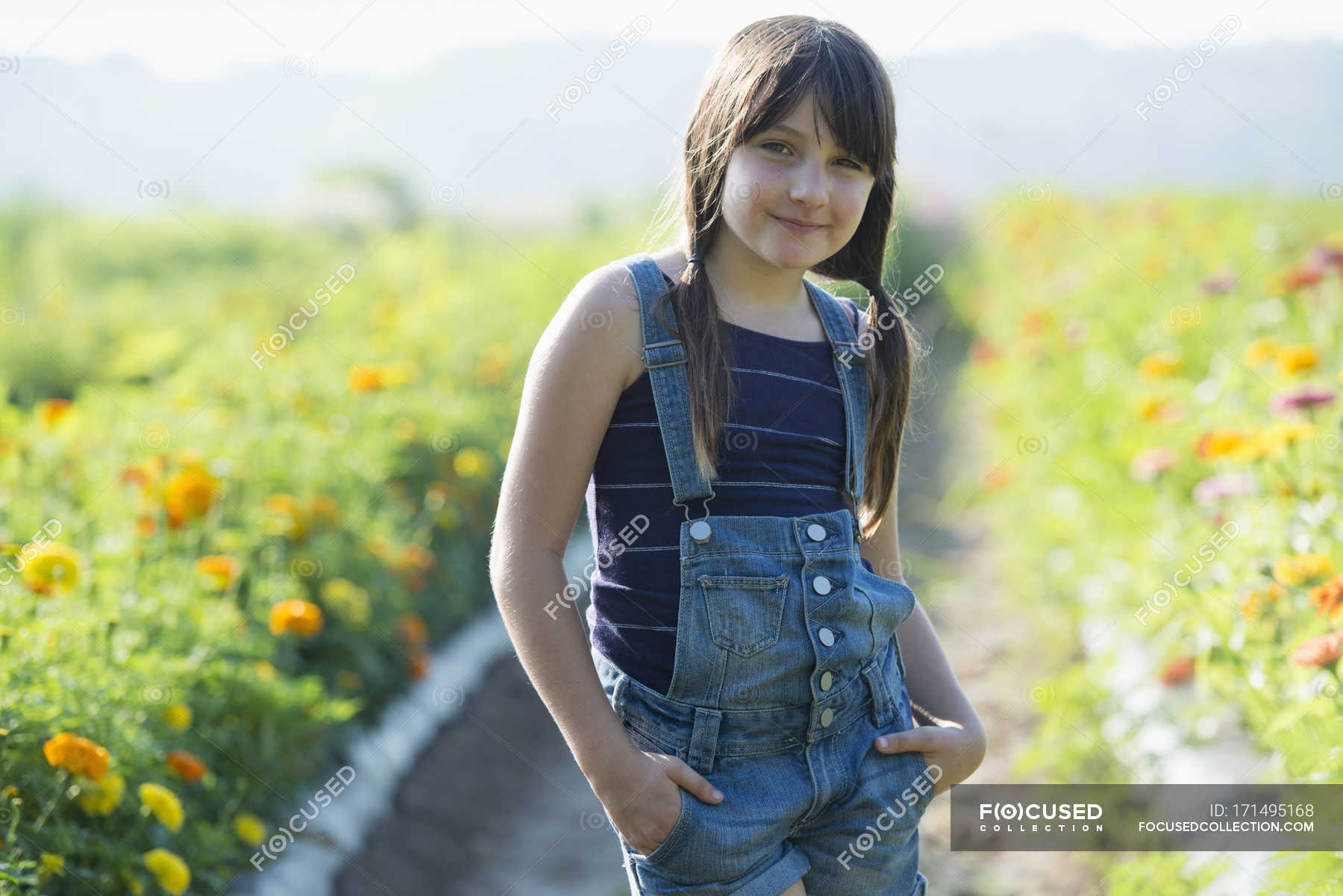 Teenage girl standing in flower field — flower farm, Front View - Stock ...