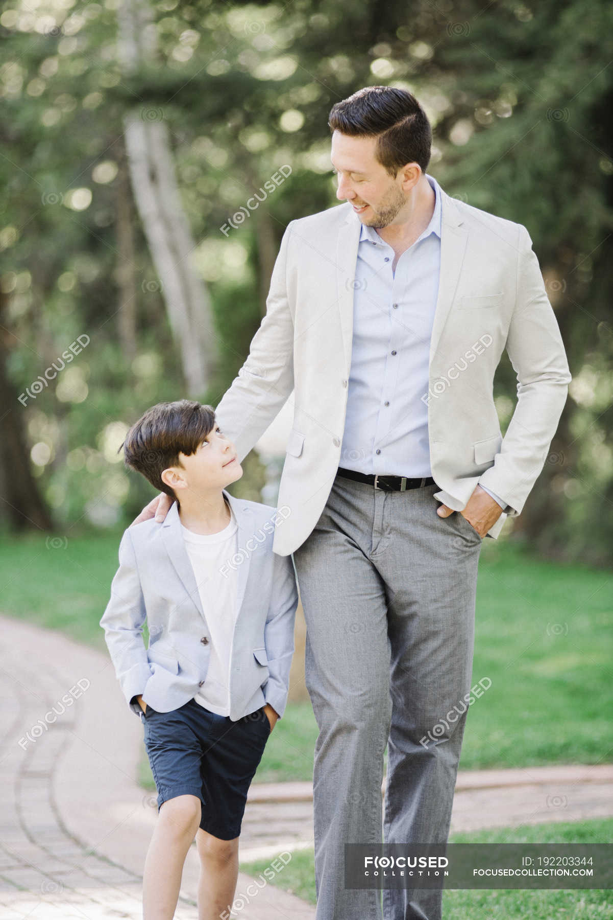 Father And Son Walking Along Path In Garden Childhood Country 