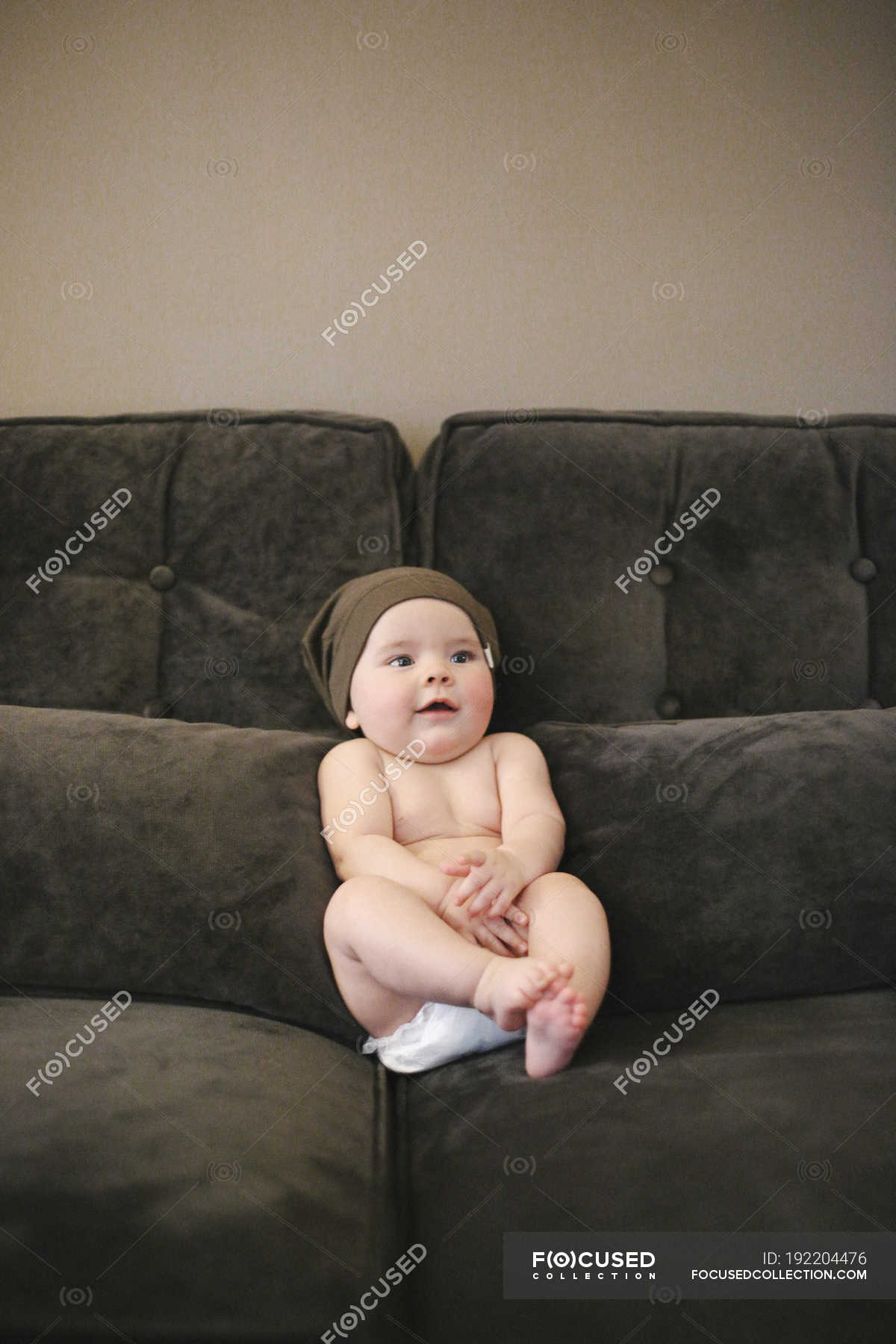 Baby sitting on discount couch