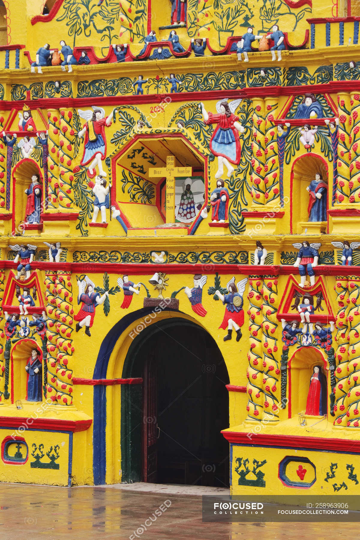 Colorful facade of church of San Andres Xecul, Guatemala — front door, colors - Stock Photo | #258963906