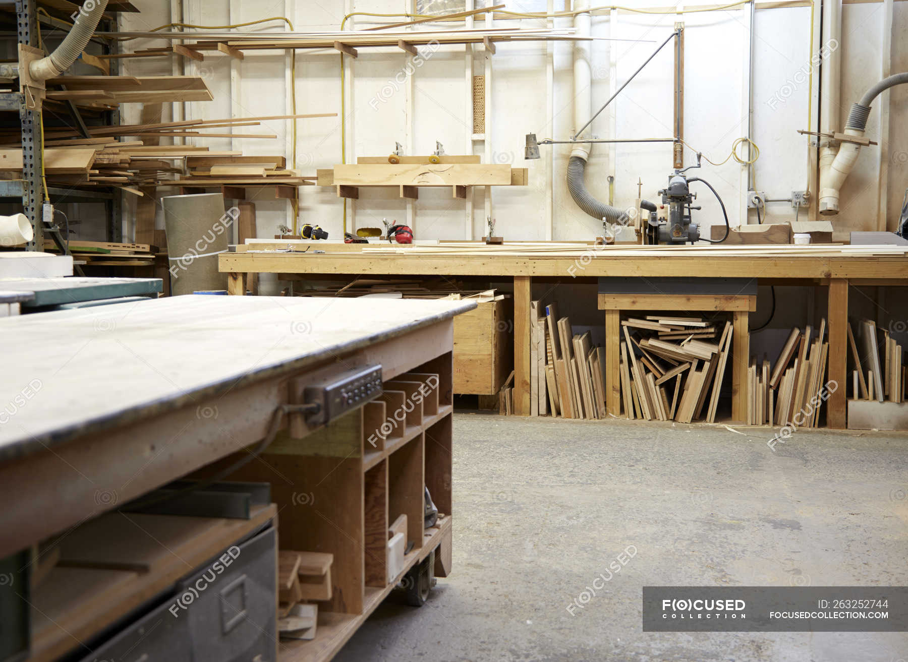 Wood, workbenches and tools in industrial carpentry workshop — america ...