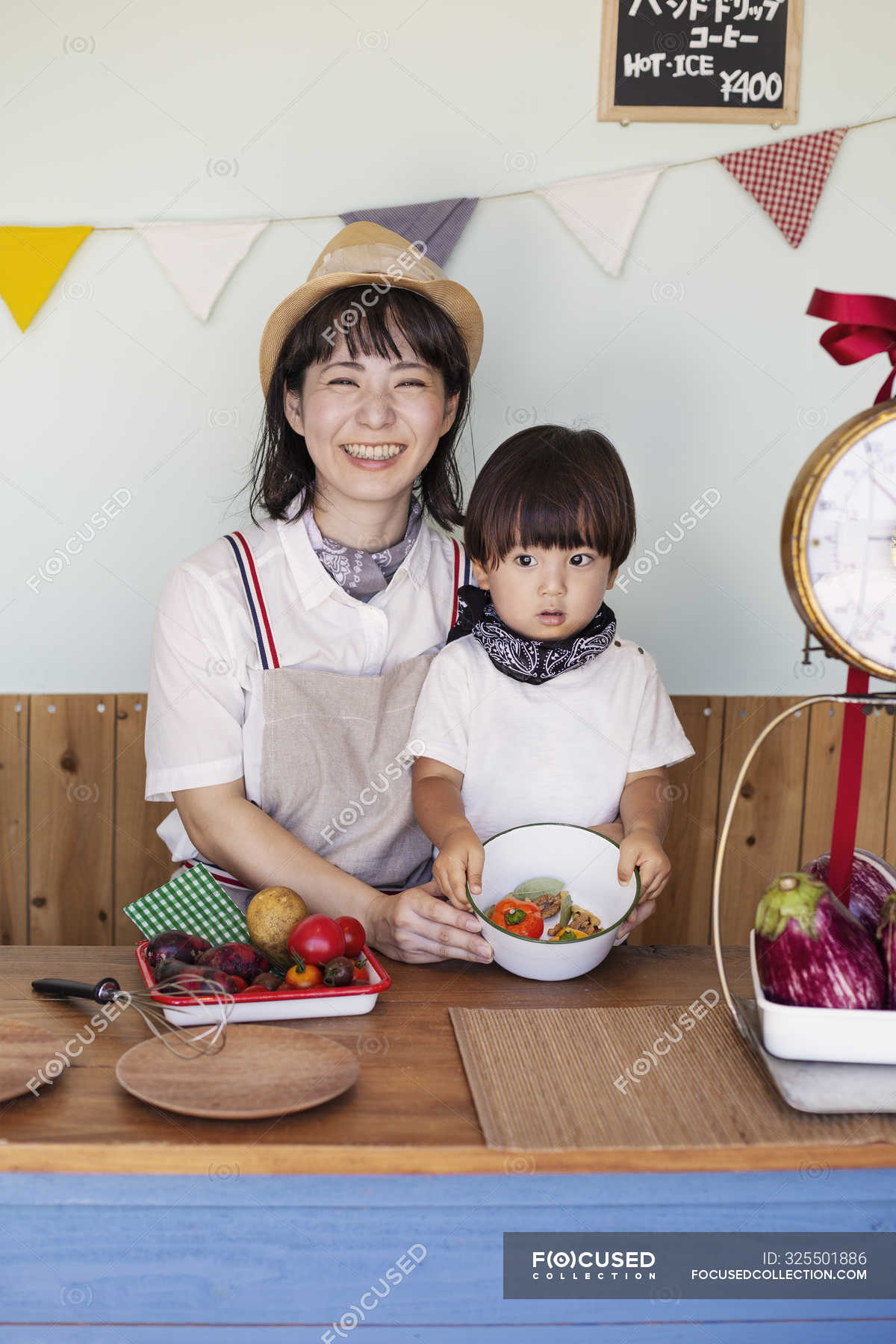 ©Mint ImagesJapanese woman and boy standing in a