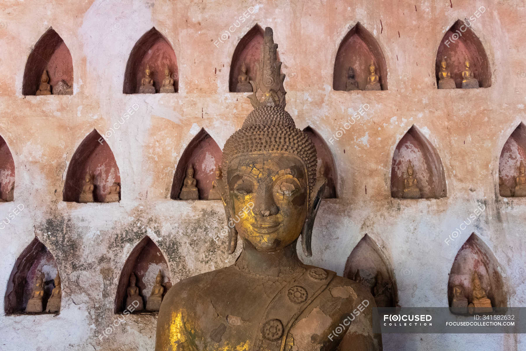 Wat Si Saket collection of statues in wall niches, Vientiane, Laos ...