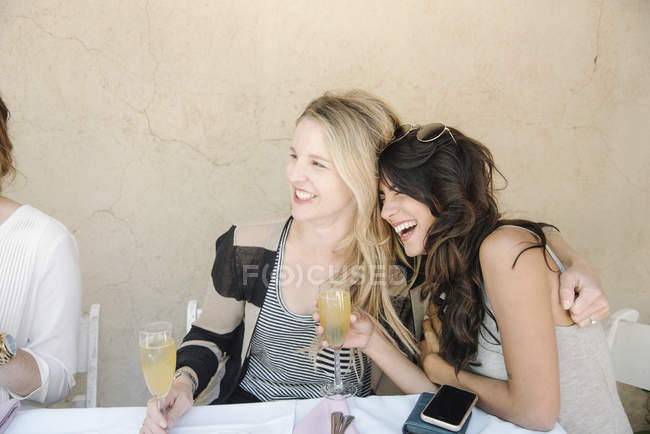 Women holding glasses of champagne. — Stock Photo