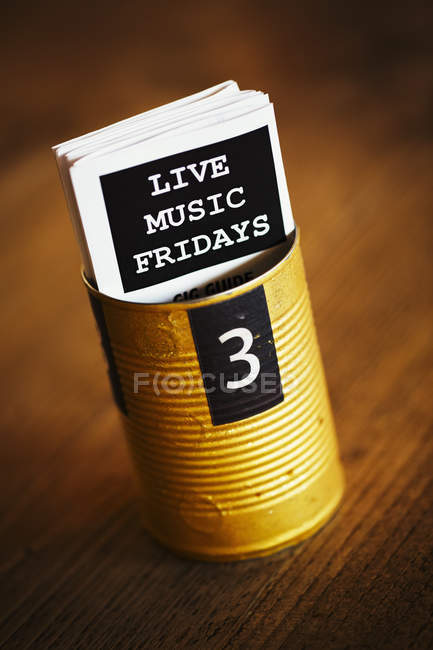 Tin with flyers advertising live music. — Stock Photo