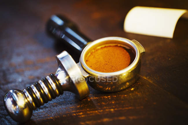 Coffee grounds in the metal holder — Stock Photo