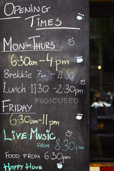 Chalk board with opening times — Stock Photo