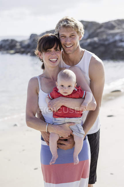 Two people and a baby. — Stock Photo