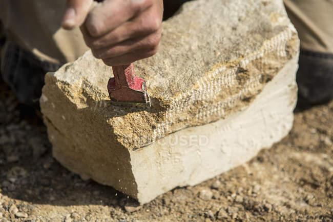 Construction worker holding a chisel — Stock Photo