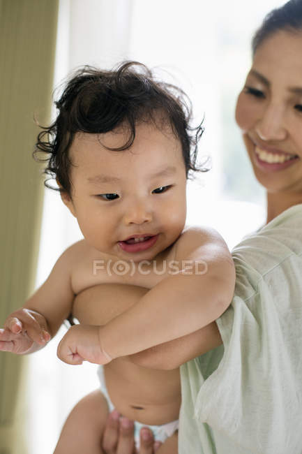 Mother holding her baby boy. — Stock Photo