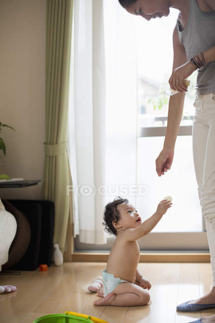 Mother and son at a living room — Stock Photo