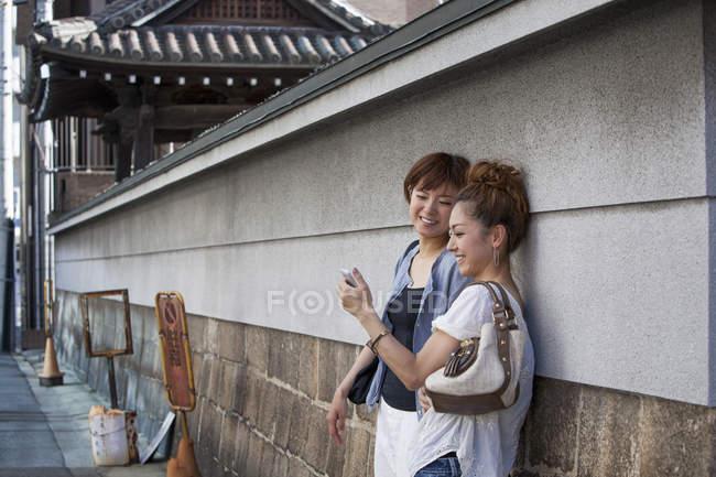 Japanese women standing outdoors — Stock Photo