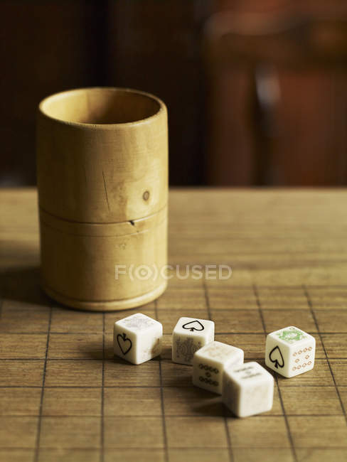 Five dice with printed faces — Stock Photo