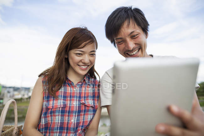 Japanese Friends in the park. — Stock Photo
